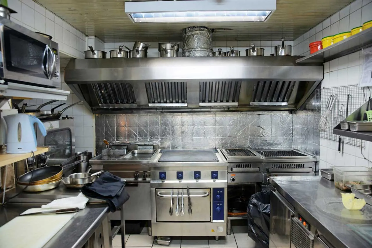 Restaurant hood cleaning technician servicing an Atlanta commercial kitchen exhaust system